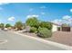Charming home with a stone-accented facade, well-manicured landscaping, and a spacious two-car garage at 564 Lampshire Ln, Pahrump, NV 89060