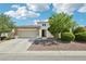 Charming home with a stone-accented facade, well-manicured landscaping, and a spacious two-car garage at 564 Lampshire Ln, Pahrump, NV 89060