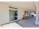 Covered patio with sliding glass door and windows to the house, plenty of room for outdoor seating at 564 Lampshire Ln, Pahrump, NV 89060