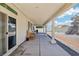 Extended covered patio, perfect for outdoor dining and relaxation, with a view of the spacious backyard at 564 Lampshire Ln, Pahrump, NV 89060