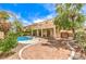 Expansive backyard featuring a refreshing private pool, mature landscaping, and shaded patio at 5862 Bluthe Bridge Ave, Las Vegas, NV 89141