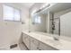 Bathroom features double sinks, vanity, shower, tub and large mirror at 5862 Bluthe Bridge Ave, Las Vegas, NV 89141