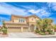 Charming two-story home featuring a well-maintained yard, arched entry and a spacious two-car garage at 5862 Bluthe Bridge Ave, Las Vegas, NV 89141