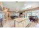 Eat-in kitchen overlooking living area with stainless appliances and outdoor dining area near private pool at 5862 Bluthe Bridge Ave, Las Vegas, NV 89141