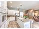 Bright kitchen featuring white cabinets, stainless steel appliances and center island at 5862 Bluthe Bridge Ave, Las Vegas, NV 89141