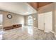 Bright living room with tile floors, a large window, and neutral walls at 5862 Bluthe Bridge Ave, Las Vegas, NV 89141