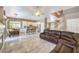 Open-concept living area featuring a spacious layout, fireplace, and a seamless flow into the kitchen at 5862 Bluthe Bridge Ave, Las Vegas, NV 89141