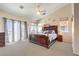 Spacious main bedroom featuring large windows, vaulted ceilings, and ample natural light at 5862 Bluthe Bridge Ave, Las Vegas, NV 89141