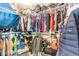 Large walk-in closet with ample shelving and hanging storage space for organization at 5862 Bluthe Bridge Ave, Las Vegas, NV 89141