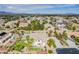 Beautiful community featuring a two-story home, pool, desert landscape, and scenic mountain views at 6214 Ebony Legends Ave, Las Vegas, NV 89131