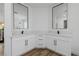 Elegant bathroom featuring double sinks, quartz countertop, and black hardware accents at 6214 Ebony Legends Ave, Las Vegas, NV 89131