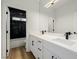 Bathroom featuring a double sink vanity with modern fixtures and hardware at 6214 Ebony Legends Ave, Las Vegas, NV 89131