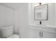 Contemporary half bathroom with a sleek vanity and modern black fixtures at 6214 Ebony Legends Ave, Las Vegas, NV 89131
