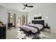 Cozy bedroom with large bed, stylish furniture, and sliding door to outdoor terrace at 6214 Ebony Legends Ave, Las Vegas, NV 89131