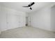 Large bedroom featuring carpet floors, ceiling fan and a triple-door closet at 6214 Ebony Legends Ave, Las Vegas, NV 89131