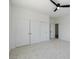 Spacious bedroom with large closet doors and neutral carpeting at 6214 Ebony Legends Ave, Las Vegas, NV 89131