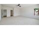 Bright bedroom with a window, ceiling fan, and double door closet at 6214 Ebony Legends Ave, Las Vegas, NV 89131