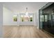 Open-concept dining area with hardwood floors and a built-in wine cellar at 6214 Ebony Legends Ave, Las Vegas, NV 89131