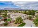 A beautiful home is complemented by a well-manicured yard and picturesque mountain views in the background at 6214 Ebony Legends Ave, Las Vegas, NV 89131