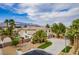 Stunning two-story home with desert landscaping, mountain views, and spacious driveway at 6214 Ebony Legends Ave, Las Vegas, NV 89131