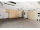 Spacious garage with built in storage cabinets for organization at 6214 Ebony Legends Ave, Las Vegas, NV 89131