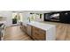 Contemporary kitchen boasts a large island, modern appliances, and hardwood flooring at 6214 Ebony Legends Ave, Las Vegas, NV 89131