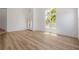 Bright and open living space featuring hardwood floors and large windows at 6214 Ebony Legends Ave, Las Vegas, NV 89131