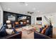 Contemporary living room boasts stylish blue sofas, modern lighting, and elegant staircase at 6214 Ebony Legends Ave, Las Vegas, NV 89131
