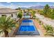 Enjoy a private pickleball court in a lush backyard setting with mountain views, perfect for recreation at 6214 Ebony Legends Ave, Las Vegas, NV 89131