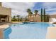 Sparkling blue swimming pool with water slide, spa, and fire pit feature at 6214 Ebony Legends Ave, Las Vegas, NV 89131