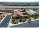 Aerial view showcasing a home's tile roof, landscaping, and location relative to the highway at 6227 Orto Vaso Ave, Las Vegas, NV 89131