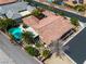 Aerial view of home with pool, tile roof, and desert landscaping providing a private backyard oasis at 6227 Orto Vaso Ave, Las Vegas, NV 89131