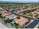 Expansive aerial view of a residential neighborhood showcasing mature landscaping and houses with tile roofs at 6227 Orto Vaso Ave, Las Vegas, NV 89131
