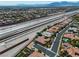 Overhead view of homes near the highway, featuring mature landscaping and well-maintained properties at 6227 Orto Vaso Ave, Las Vegas, NV 89131