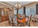Elegant dining room featuring a wooden table, patterned chairs, and a decorative china cabinet at 6227 Orto Vaso Ave, Las Vegas, NV 89131