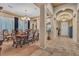 Dining room with decorative ceiling, wood table and view to entryway of home at 6227 Orto Vaso Ave, Las Vegas, NV 89131