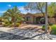 Charming home featuring desert landscaping, a brick-paved driveway, and covered parking at 6227 Orto Vaso Ave, Las Vegas, NV 89131