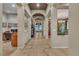Inviting hallway with arched openings, tiled flooring, and access to various rooms at 6227 Orto Vaso Ave, Las Vegas, NV 89131