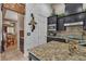 Stylish kitchen boasts granite countertops, stainless appliances, and unique design elements at 6227 Orto Vaso Ave, Las Vegas, NV 89131
