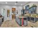 Modern kitchen with granite countertops, custom cabinetry, and an island with glass-front storage at 6227 Orto Vaso Ave, Las Vegas, NV 89131