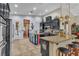 Gourmet kitchen with custom cabinets, granite countertops, and pendant lighting above a breakfast bar at 6227 Orto Vaso Ave, Las Vegas, NV 89131