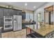 Spacious kitchen with stainless steel appliances, granite countertops, and custom cabinets for ample storage at 6227 Orto Vaso Ave, Las Vegas, NV 89131