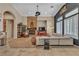 Spacious living room featuring a stone fireplace, comfortable seating, and stylish decor at 6227 Orto Vaso Ave, Las Vegas, NV 89131
