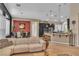 Bright living area seamlessly connects to the modern kitchen and dining space at 6227 Orto Vaso Ave, Las Vegas, NV 89131