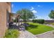 Serene backyard featuring a patio, lush lawn, and beautiful landscaping at 6567 American Eagle Ave, Las Vegas, NV 89131