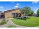 Beautiful backyard featuring green grass, a patio, a mature tree, and partial shade for comfortable outdoor living at 6567 American Eagle Ave, Las Vegas, NV 89131