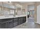 Bathroom featuring dual sinks, vanity and a large mirror at 6567 American Eagle Ave, Las Vegas, NV 89131
