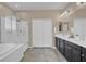 Large bathroom featuring double vanity, tub, and shower at 6567 American Eagle Ave, Las Vegas, NV 89131