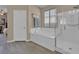 Bright bathroom featuring a soaking tub and a glass-enclosed shower at 6567 American Eagle Ave, Las Vegas, NV 89131