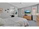 Bedroom featuring a TV, window and carpeted floor at 6567 American Eagle Ave, Las Vegas, NV 89131